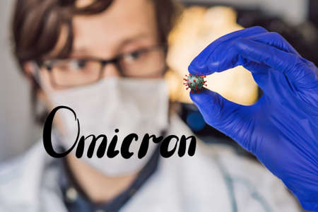 doctors or scientists researching a new strain of coronavirus or developing a vaccine against coronavirus COVID-19 and a syringe in laboratory room, concept for research and development of a vaccine against pathogens.の写真素材