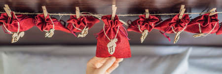 Woman making Christmas advent calendar.の写真素材