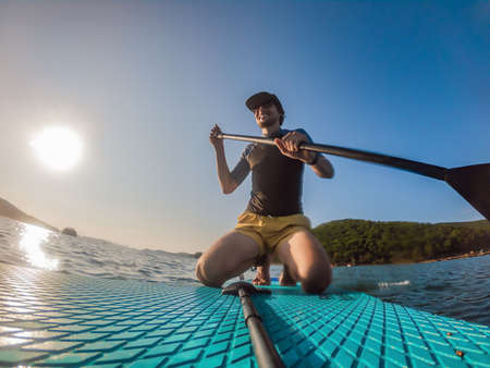 Attractive Man on Stand Up Paddle Board, SUPの写真素材