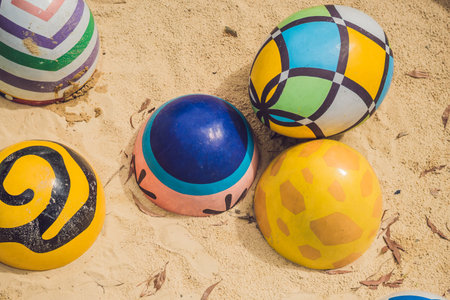 Multicolored eggs in the grass. Easter eggs hunt, outdoors. Celebrating Easter holidayの写真素材