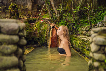Young woman tourist in Belulang Hot Springs in Bali, Village Mengesta, Penebel District, Tabanan regencyの写真素材