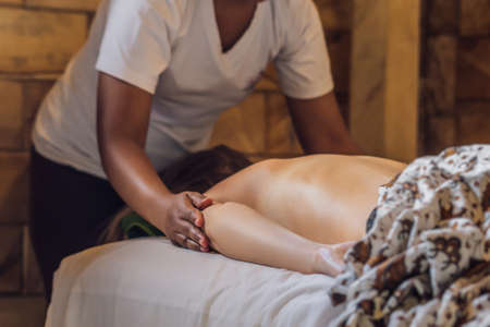 Total relaxation. Beautiful Young Wwoman Get Balinese or Thai Massageの写真素材