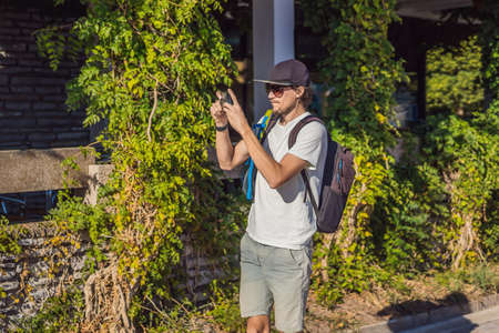 Man tourist walks along the coast of Budva in Montenegroの写真素材