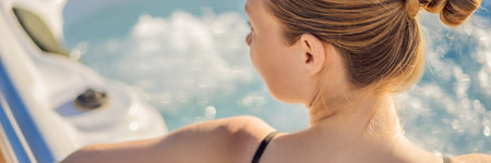 BANNER, LONG FORMAT Portrait of young carefree happy smiling woman relaxing at hot tub during...