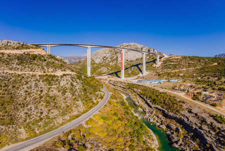Montenegro. Bridge Moracica. Reinforced concrete bridge across the Moraci gorge. The motorway Bar - Bolyare. The bridge is on the Smokovac - Uvach - Mateshevo section. The Moracica Bridge was built by the China Road and Bridge Corporation.の写真素材