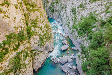 The purest waters of the turquoise color of the river Moraca flowing among the canyons. Travel around Montenegro conceptの写真素材