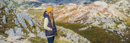 BANNER, LONG FORMAT Woman traveller in mountain landscape at national park Lovcen, Montenegro....
