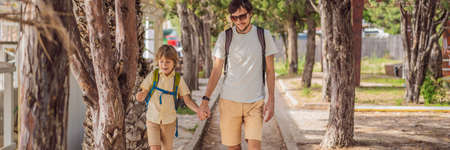 Dad and son tourists walks along the coast of Budva in Montenegro BANNER, LONG FORMATの写真素材