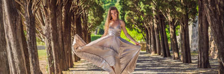 BANNER, LONG FORMAT Woman tourist walking in Montenegro. Panoramic summer landscape of the beautiful green Royal park Milocer on the shore of the the Adriatic Sea, Montenegroの写真素材