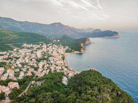Aerial view of the small town Petrovac, Montenegro and Lucice beach Portrait of a disgruntled girl sitting at a cafe tableの写真素材