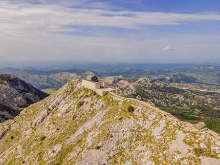 Montenegro. Lovcen National Park. Mausoleum of Negosh on Mount Lovcen. Drone. Aerial view. Viewpoint. Popular tourist attraction. Petar II Petrovic-Njegos mausoleum on the top of mount Lovchen in Montenegro. Aerial view, drone.の写真素材