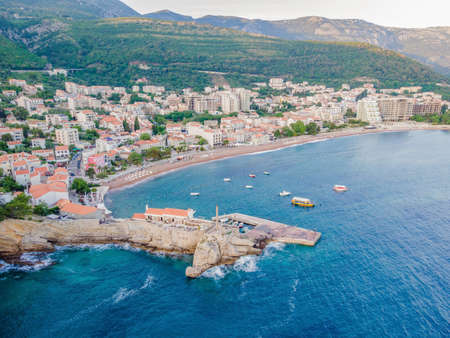 Aerial view of the small town Petrovac, Montenegro and Lucice beach Portrait of a disgruntled girl sitting at a cafe tableの写真素材