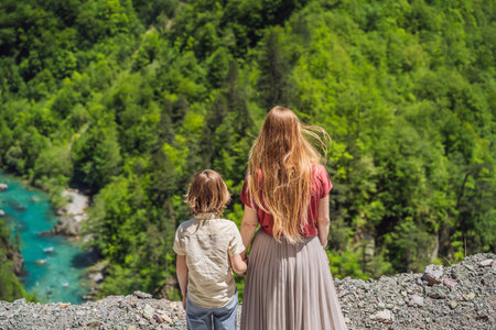 Mom and son tourists on the background River bend, Montenegro,.natural landscape, mountain river...