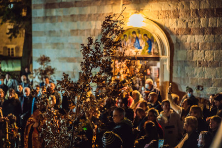 Montenegro, Budva 7.01. 2021: Christian Christmas in Montenegro, the feast of the oak branch. People burn an oak branch in honor of Christmasのeditorial素材