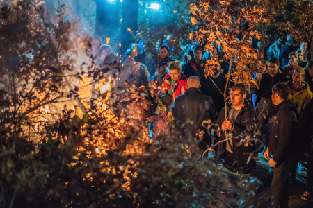 Montenegro, Budva 7.01. 2021: Christian Christmas in Montenegro, the feast of the oak branch. People burn an oak branch in honor of Christmasのeditorial素材