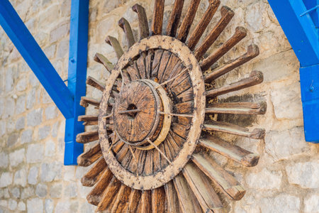 old vintage wooden wheel. 19th century wagon wooden wheel. antique metal parts made in the forgeの写真素材