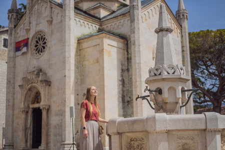 Woman tourist in Herceg Novi old town. Historical and touristic center of Herceg Novi. Montenegroの写真素材