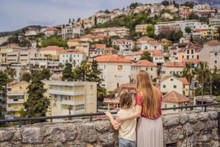 Mom and son tourists in Herceg Novi old town. Historical and touristic center of Herceg Novi. Montenegroの写真素材