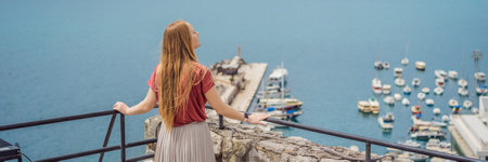 BANNER, LONG FORMAT Woman tourist in Herceg Novi old town. Historical and touristic center of Herceg Novi. Montenegroの写真素材