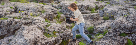 BANNER, LONG FORMAT Boy tourist on background of Picturesque Niagara Falls on the river Cievna. Montenegro, near Podgorica. Travel around Montenegro conceptの写真素材