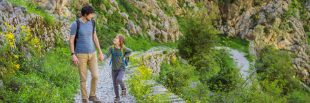 family travel - father and son hiking in mountains of Montenegro, Kotor BANNER, LONG FORMAT