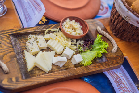 Turkish breakfast cheese. Pastries, vegetables, greens, olives, cheeses, fried eggs, spices, jams,...