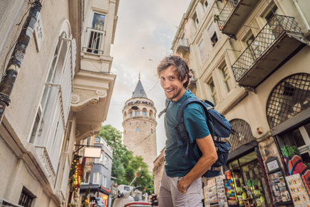 Portrait of man tourist with view of Galata tower in Beyoglu, Istanbul, Turkey. Turkiyeの写真素材