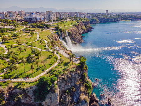 Lower Duden Falls drop off a rocky cliff falling from about 40 m into the Mediterranean Sea in amazing water clouds. Tourism and travel destination photo in Antalya, Turkey. Turkiye.の写真素材