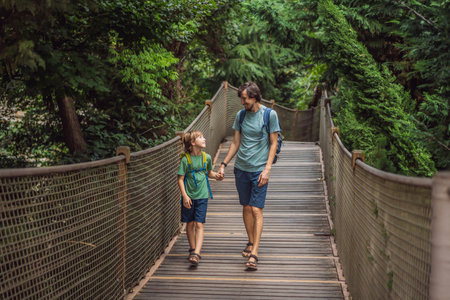 father and son tourists in Rope bridge in Yildiz Park. Besiktas, Istanbul, Turkey. Turkiye....