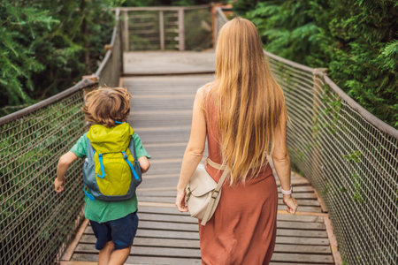 mother and son tourists in Rope bridge in Yildiz Park. Besiktas, Istanbul, Turkey. Turkiye. Traveling with kids conceptの写真素材