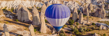 BANNER, LONG FORMAT Colorful hot air balloons flying over at fairy chimneys valley in Nevsehir,...