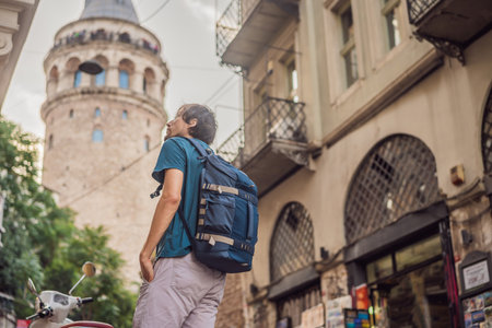 Portrait of man tourist with view of Galata tower in Beyoglu, Istanbul, Turkey. Turkiyeの写真素材