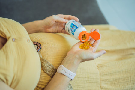 12.16.22, USA, Miami: A pregnant woman received an iherb package. doctors best vitamin D3. Vitamins and minerals for a healthy pregnancy at iherbのeditorial素材