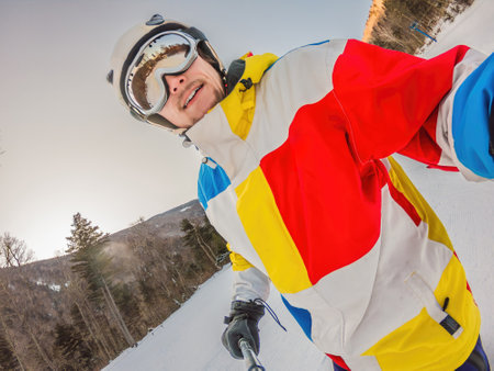 A daring man conquers snowy slopes with style, showcasing skill and thrill as he maneuvers on a snowboard, capturing the essence of winter adventureの写真素材
