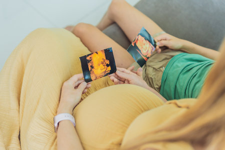 Expectant mother tenderly shares the joy of her unborn baby with her son, showing him heartwarming...