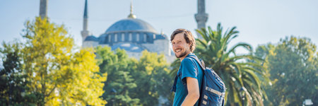 Man tourist enjoying the view Blue Mosque, Sultanahmet Camii, Istanbul, Turkey BANNER, LONG FORMATの写真素材
