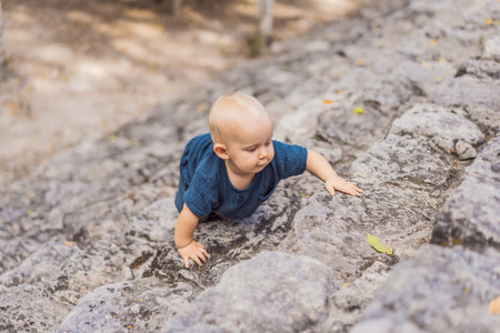 Baby tourist at Coba, Mexico. Ancient mayan city in Mexico. Coba is an archaeological area and a...