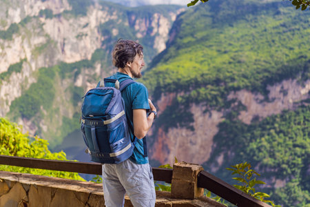 Male tourist exploring Sumidero Canyon National Park, Mexico. Adventure, natural exploration, and...