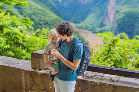 Dad and his baby son travelers exploring Sumidero Canyon National Park, Mexico. Adventure, natural exploration, and travel experience conceptの写真素材