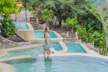 Female tourist at the hot springs of Grutas Tolantongo, Mexico. Adventure, relaxation, and natural...