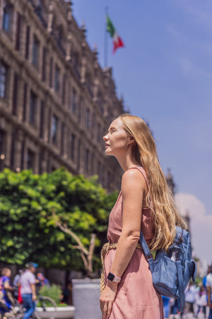 Female tourist in the central square of Mexico City, Zocalo. Cultural exploration, travel, and historic architecture conceptの写真素材