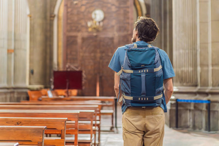 Man tourist exploring the grandeur of Catedral de Puebla, Mexico. Captivating architecture, cultural heritage, and a historic travel experience in one of Mexicos iconic landmarksの写真素材