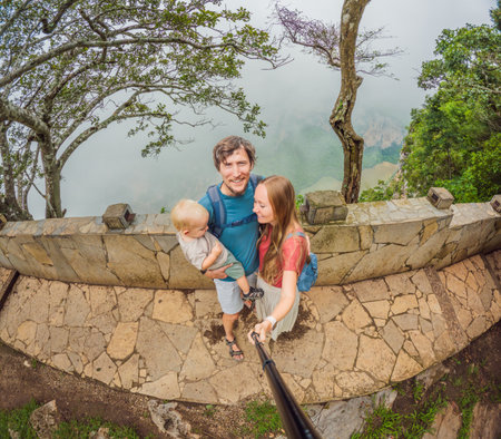 Family exploring Sumidero Canyon, Mexico. Parents and their young son on an adventurous journey through stunning cliffs, lush landscapes, and river scenery. Concept of family travel, eco-tourism, and bonding in natureの写真素材