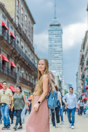 Female tourist exploring Latin American Tower in Mexico City. Iconic skyscraper, historic architecture, and urban exploration conceptの写真素材