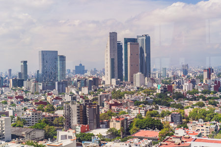 Panoramic view of Mexico City from above, showcasing the sprawling urban landscape, iconic...