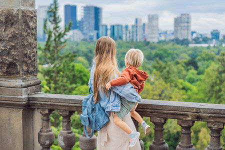 Mother with her young son near Chapultepec Castle in Mexico City, enjoying a cultural family trip. Parenthood, love, heritage sightseeing, and family bonding travel conceptの写真素材