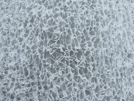 Broken glass structure, background with shards of transparent glass, broken glass texture.