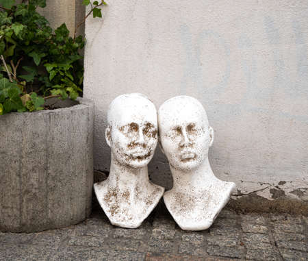 Sculpture, bust, head in the street, street art, space for text, wall texture, a man, woman plaster bust, abstract fancy backgroundの写真素材