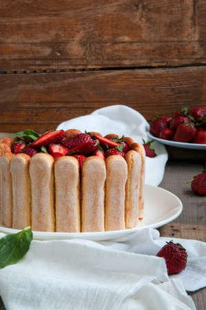 Strawberry Basil Tiramisu with fresh berries on a wooden backgroundの写真素材