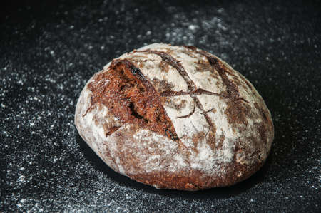 Freshly baked homemade artisan sourdough rye and white flour bread. Close up. Copy space.の写真素材